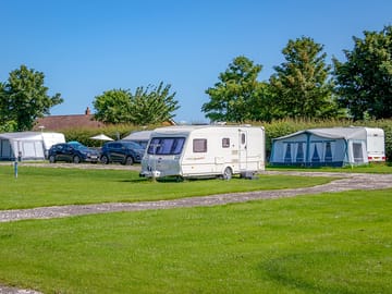 All grass pitches are nearer to the toilet block and do not offer a view of the lake