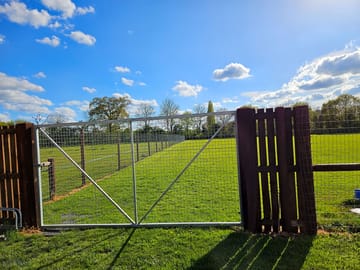 Secure dog-walking field for a fee