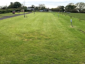 Electric grass tent pitch