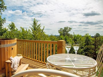 Kite's nest raised decking area with wood-fired hot tub