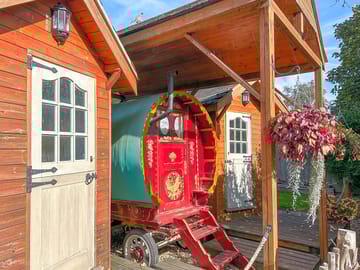 Ruby rose and shepherd's huts containing a shower room and kitchen
