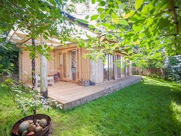 Tree-shaded cabin with decking
