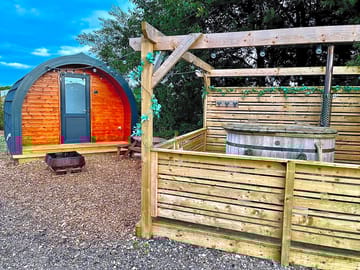 Heated pod with wood fired hot tub lake views