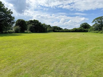 Spacious neatly mown camping field
