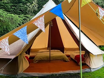 Bell tent with awning and bunting