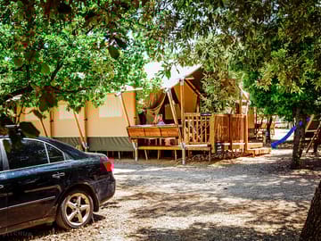 Room for one car by each tent