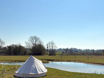 Bell tent by the pond