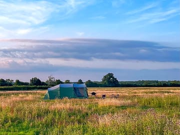 Our camping meadow is quiet and secluded, with only a handful of pitches and panoramic views.
