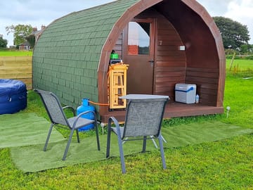 Number 7 pod with it's very own hot tub. the fairy lights at night add that romantic touch.