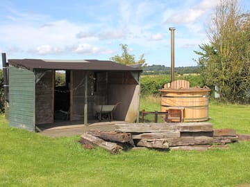The brazier and wood burning hot tub shared amongst yurt guests