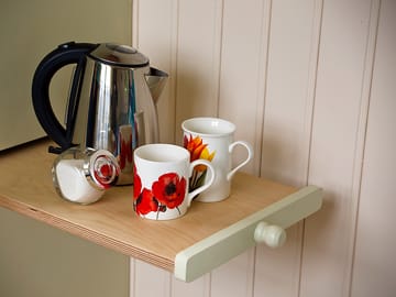 The pull-out table by the kitchenette area