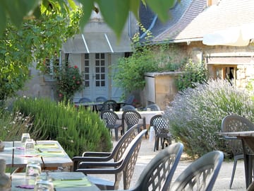 Courtyard restaurant surrounded by fragrant herbs