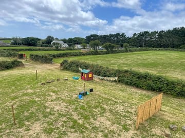 View across fields with play area in foreground