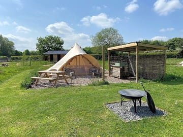 Family bell tent with private out door kitchen and fire pit.