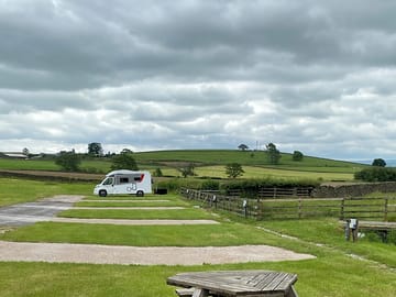 Pitches alongside a picnic bench
