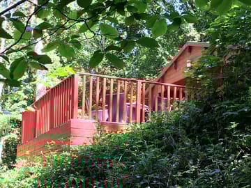 Spacious terrace with views over the woodland towards the stream