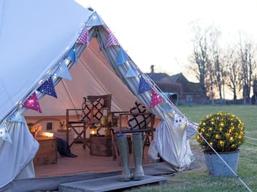 The tents have solar fairy lights, along with candle lanterns inside