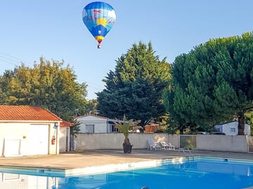 Hot air balloon over the pool