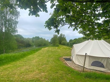 Bell tent situated lakeside in cut meadowland which offers abundance of wildlife and privacy