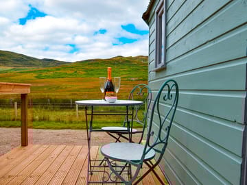 Bistro table and chairs for outdoor dining on the decking