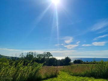 Path to the grass pitch and sea view