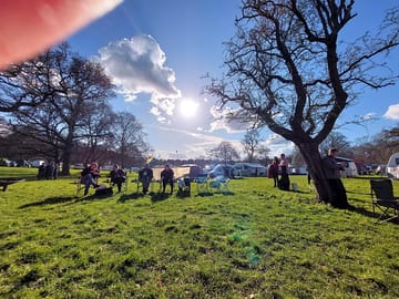 Level grass camping field with room for all