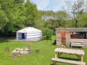 Sunshine yurt with kitchen dining area firepit and picnic table