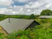 The view over the top of the tents to the valley beyond