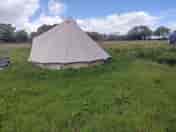 Most remote pitch only for tents, alongside woods in upper solar field