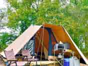 The pre erected tent with chairs, kitchen, crockery & double bedroom.