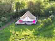 Red bell tent on decking