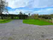 Electric hardstanding and grass touring pitch
