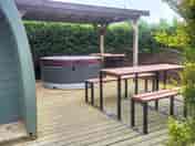 Pod with outdoor seating and hot tub