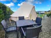 Bell tent with outdoor seating area