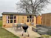 Outside area with a barbecue and fire pit
