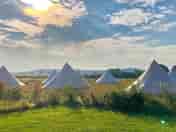 Glamping tents in the morning sun