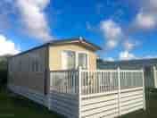 Zest caravan with patio doors to a south-facing deck