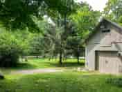 RV and camper parking to the left of the barn