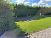 Pitch lined with hedges for privacy
