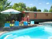 Sunloungers next to the pool