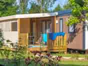 Static caravan in a leafy pitch