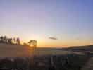 View of the sunset over the sea from our pitch