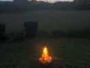 A fire with a view of the sunset.