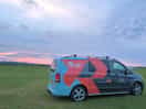 Our redsky bikes work van on the campsite with the lovely sunset