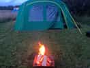 The fire in front of the tent.