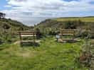 Benches overlooking the coast path and a nature trail. sit in peace and watch the sunset.
