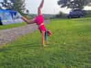 Bella doing handstands on the pitch