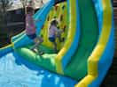 Swimming pool or bouncy castle is out in warm weather