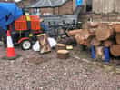 Log sawing next to parking