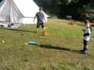 My boys playing with toys by the tent.